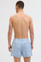 Back image of a model wearing the Jack and jones milano woven 3 pk trunks in light blue, by brand Jack&jones