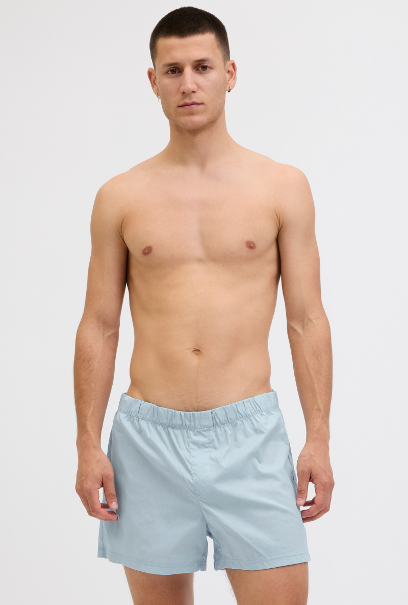 Front image of a model wearing Jack and jones milano woven 3 pk trunks in light blue, by brand Jack&jones