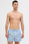Front image of a model wearing the Jack and jones milano woven 3 pk trunks in light blue, by brand Jack&jones