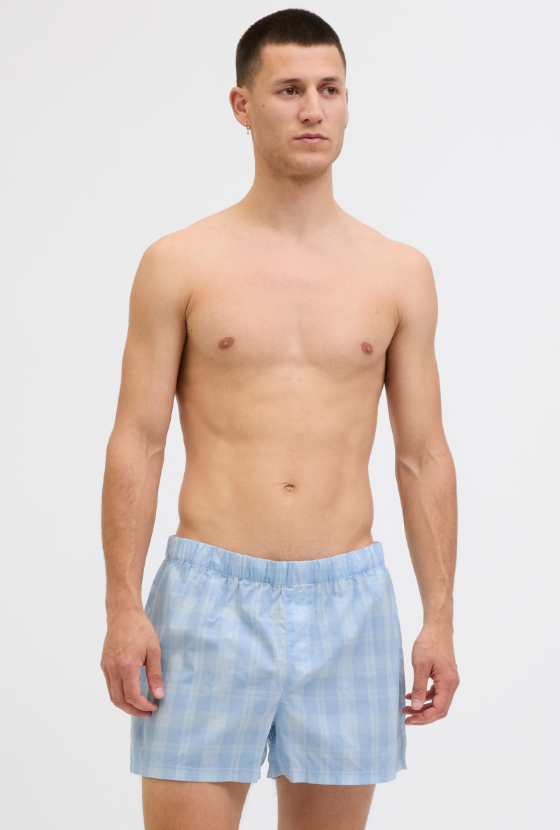 Front image of a model wearing Jack and jones milano woven 3 pk trunks in light blue, by brand Jack&jones