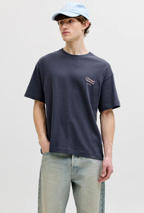 Front image of a model wearing the Montauk back graphic tee in charcoal, by brand Jack&jones