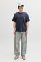 Front image of a model wearing the Montauk back graphic tee in charcoal, by brand Jack&jones