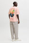 Back image of a model wearing the Montauk back graphic tee in peach, by brand Jack&jones