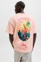 Back image of a model wearing the Montauk back graphic tee in peach, by brand Jack&jones
