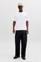 Front image of a model wearing the Montauk back graphic tee in white, by brand Jack&jones
