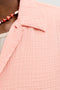 Front image of a model wearing the Nantucket double cloth ss shirt in peach, by brand Jack&jones