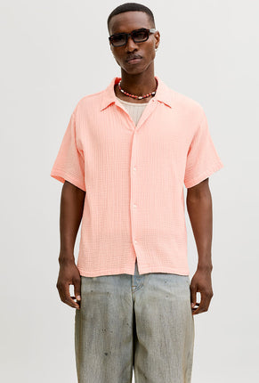Front image of a model wearing Nantucket double cloth ss shirt in peach, by brand Jack&jones