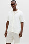 Front image of a model wearing Nantucket double cloth ss shirt in off white, by brand Jack&jones