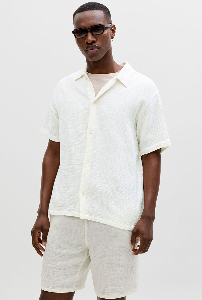 Front image of a model wearing Nantucket double cloth ss shirt in off white, by brand Jack&jones
