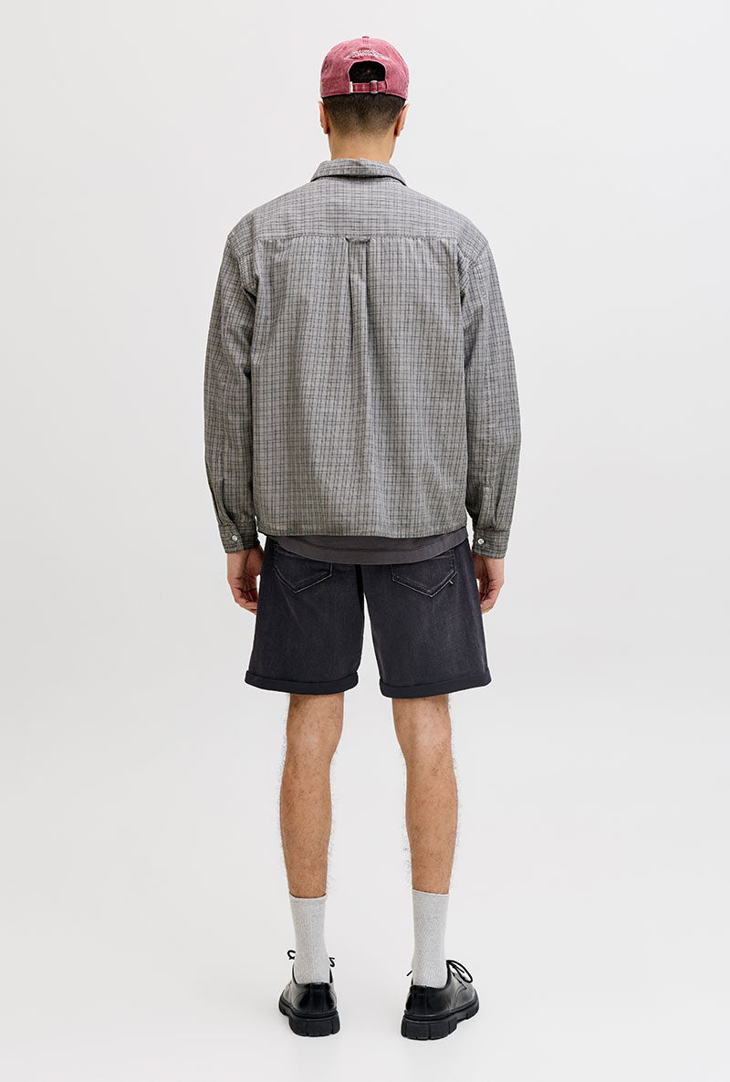 Back image of a model wearing Rick jj fox denim shorts in black, by brand Jack&jones