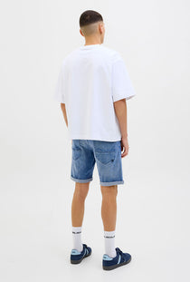 Back image of a model wearing the Rick jj fox denim shorts in light denim, by brand Jack&jones