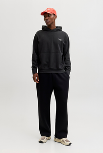 Front image of a model wearing the Jack and jones roar sweat hood in black, by brand Jack&jones