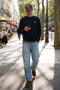Front image of a model wearing the Rush sweat crew neck sweatshirt in black, by brand Jack&jones