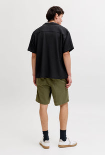 Back image of a model wearing the Sean resort shirt in black, by brand Jack&jones