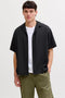 Front image of a model wearing Sean resort shirt in black, by brand Jack&jones