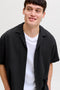 Front image of a model wearing the Sean resort shirt in black, by brand Jack&jones