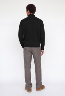 Back image of a model wearing the Soho ollie high neck zip knit in black, by brand Jack&jones