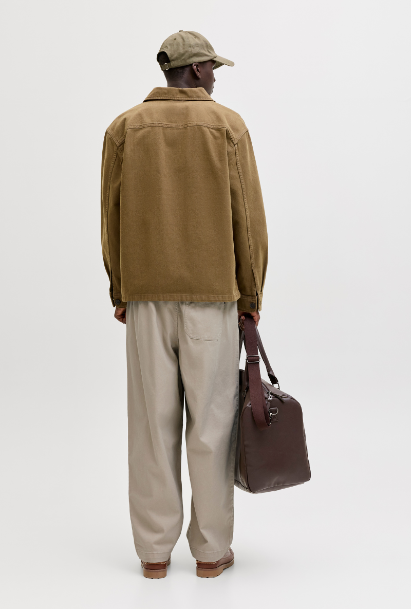 Back image of a model wearing Jack and jones stevan dylan jogger in stone, by brand Jack&jones