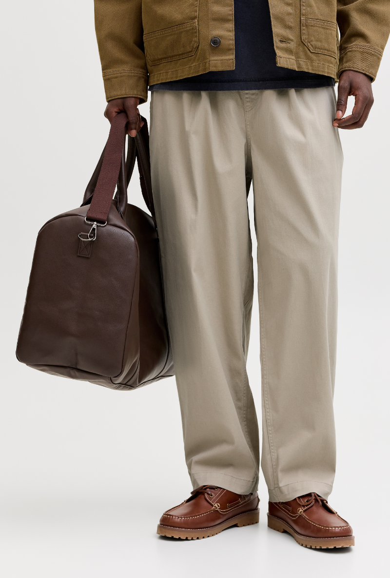 Front image of a model wearing Jack and jones stevan dylan jogger in stone, by brand Jack&jones