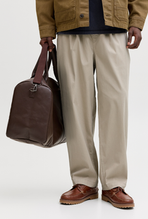 Front image of a model wearing the Jack and jones stevan dylan jogger in stone, by brand Jack&jones