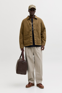 Front image of a model wearing the Jack and jones stevan dylan jogger in stone, by brand Jack&jones