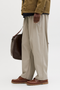 Side image of a model wearing the Jack and jones stevan dylan jogger in stone, by brand Jack&jones