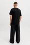 Back image of a model wearing the Tom tee ss crew neck in black, by brand Jack&jones