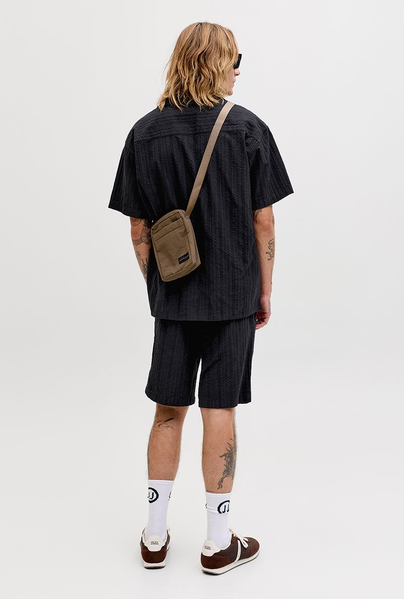 Back image of a model wearing Tyson resort shirt in black, by brand Jack&jones