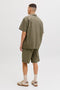 Back image of a model wearing the Tyson resort shirt in khaki, by brand Jack&jones