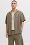 Front image of a model wearing Tyson resort shirt in khaki, by brand Jack&jones