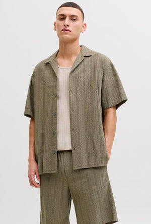 Front image of a model wearing the Tyson resort shirt in khaki, by brand Jack&jones