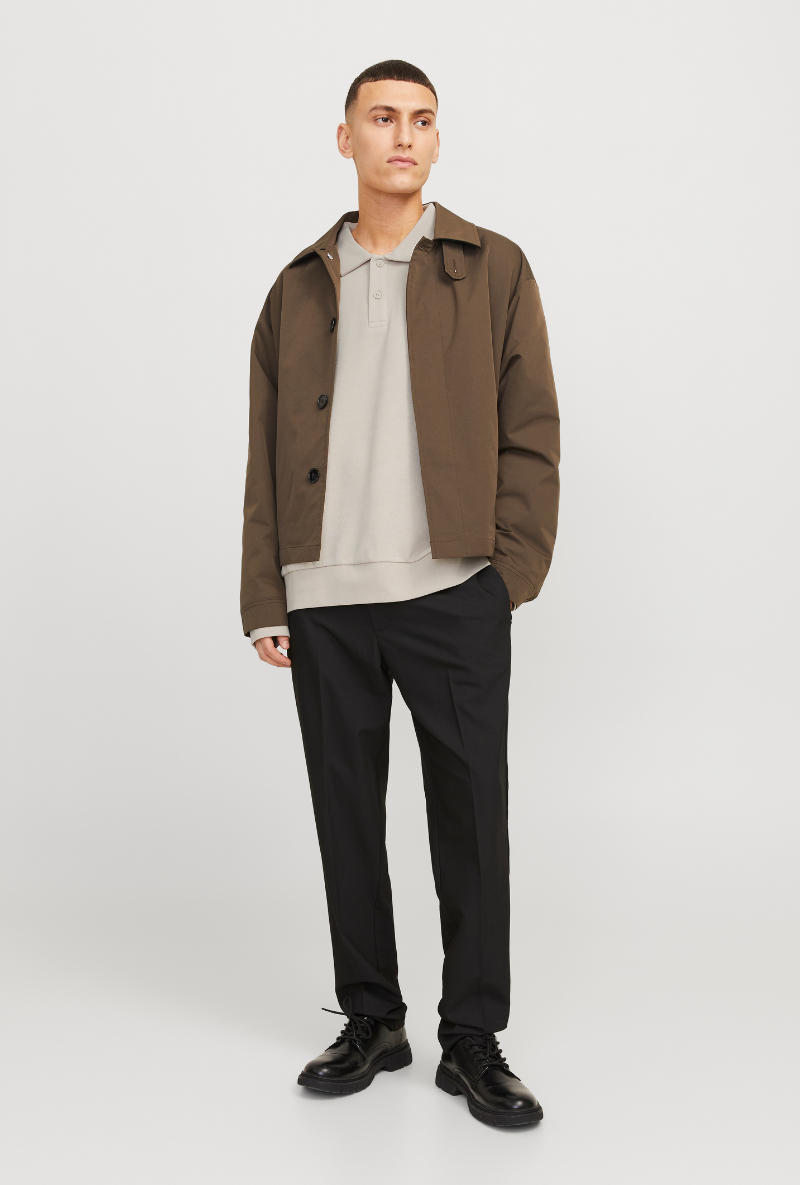 Front image of a model wearing Jack and jones bradley sweat polo in stone, by brand Jack&jones