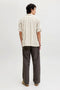 Back image of a model wearing the Jeff resort stripe shirt in olive, by brand Jack&jones