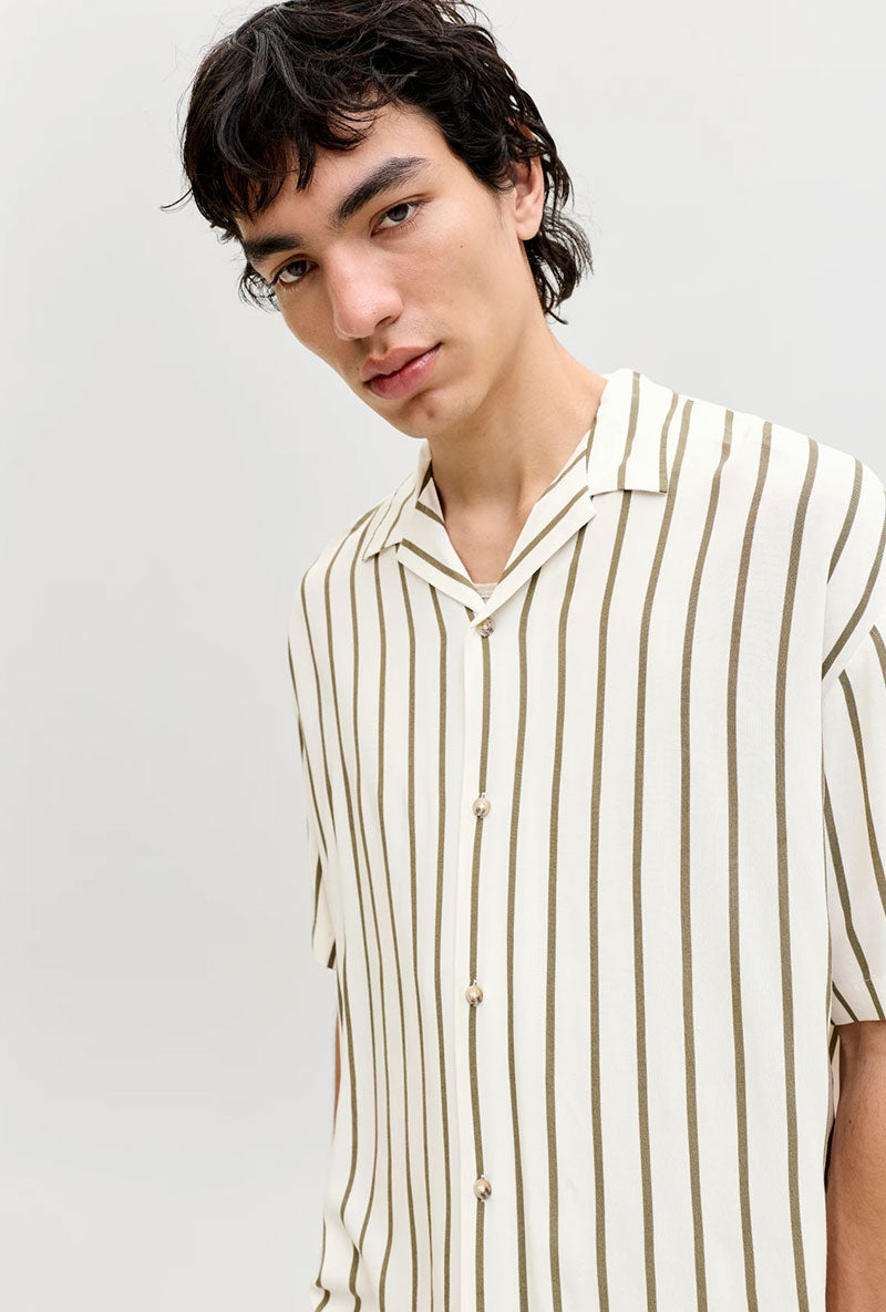 Front image of a model wearing Jeff resort stripe shirt in olive, by brand Jack&jones