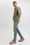 Side image of a model wearing the Mike original st 550 jeans in denim, by brand Jack&jones