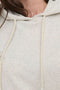 Front image of a model wearing the Amalfi life ls hood in oat, by brand Jacqueline de yong