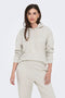 Front image of a model wearing Amalfi life ls hood in oat, by brand Jacqueline de yong