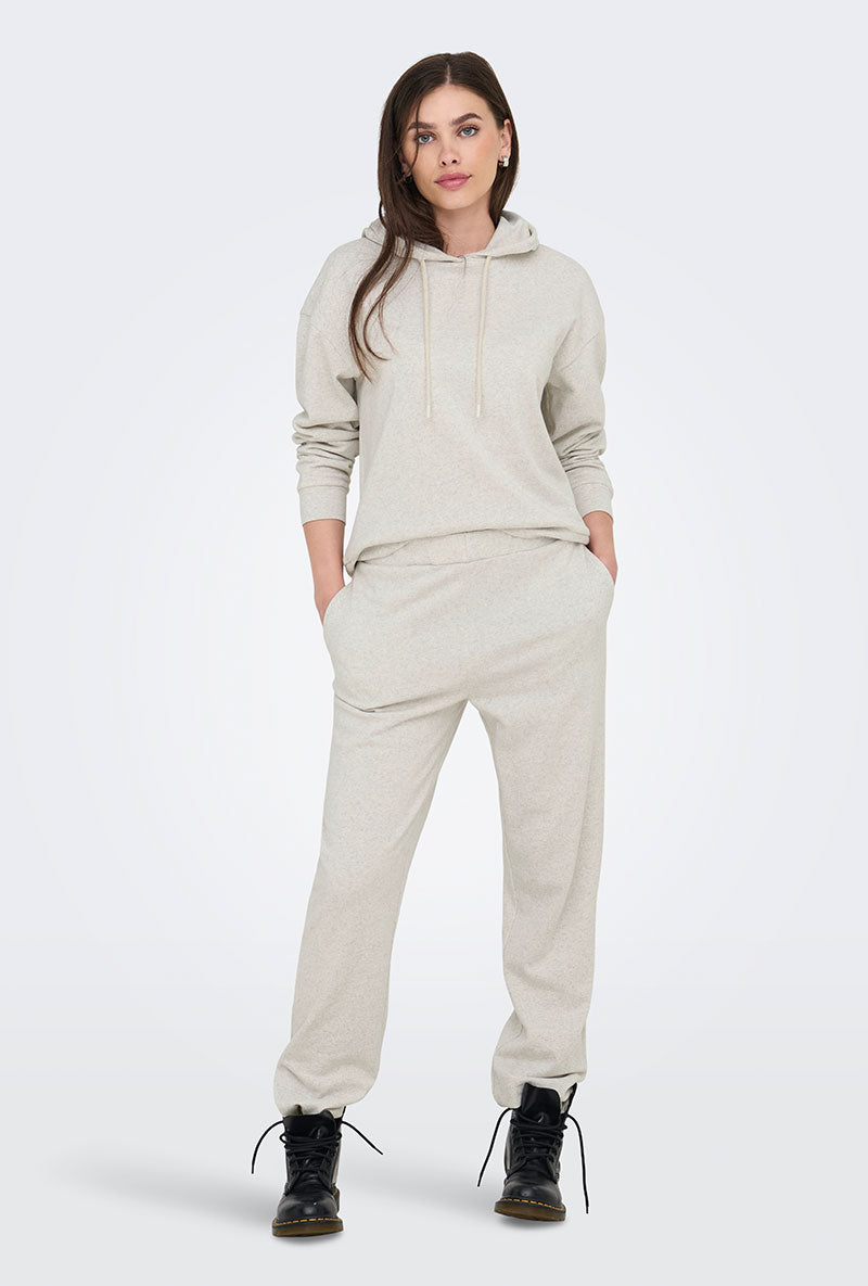 Front image of a model wearing Amalfi life ls hood in oat, by brand Jacqueline de yong
