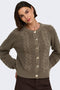Front image of a model wearing the Carmella ls cable knit cardigan in brown, by brand Jacqueline de yong