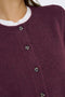 Front image of a model wearing the Chloe l/s knit cardigan in burgundy, by brand Jacqueline de yong