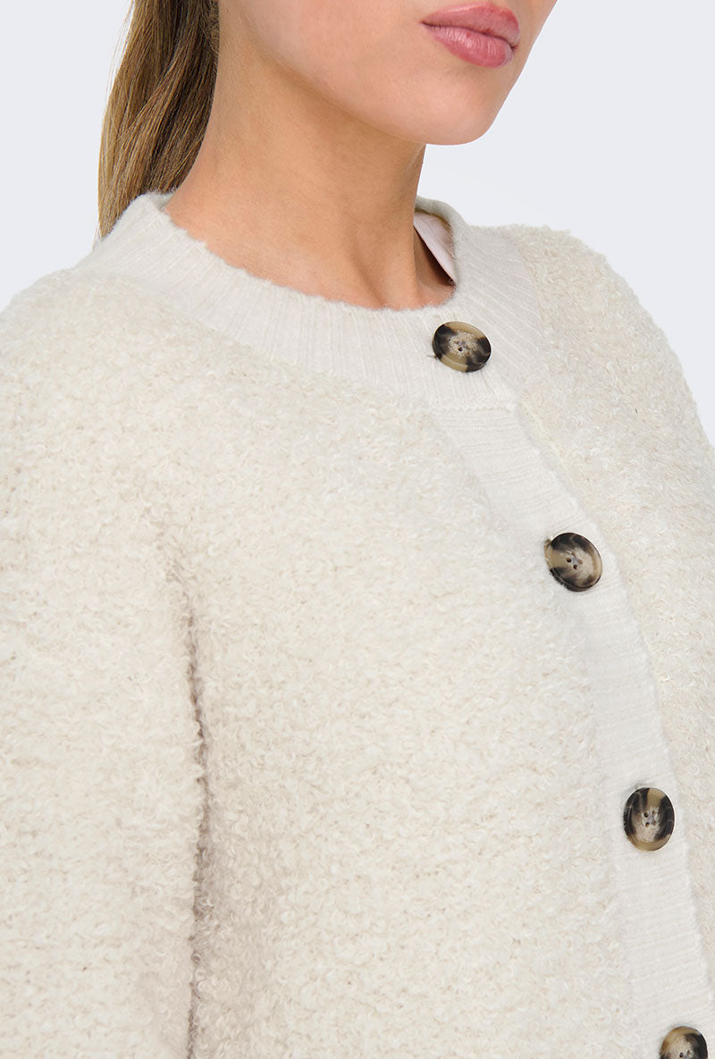 Front image of a model wearing Eira life oneck cardigan in off white, by brand Jacqueline de yong