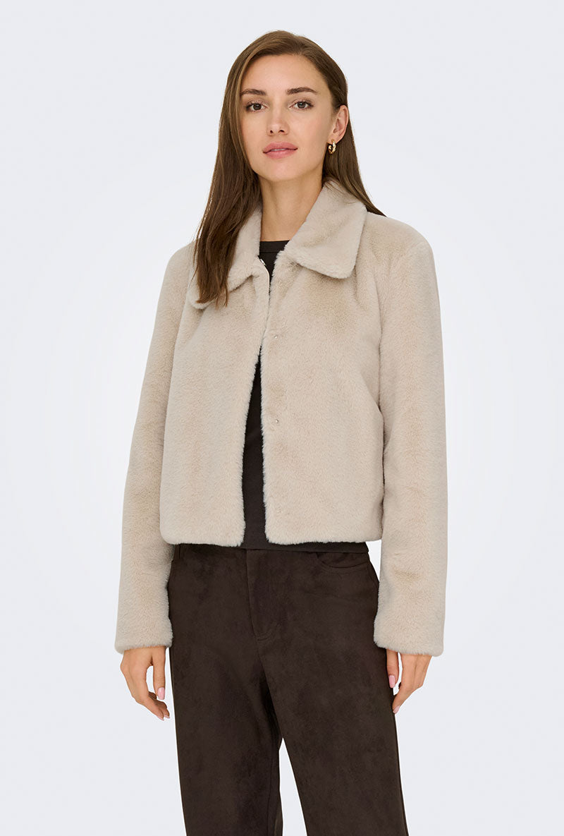 Front image of a model wearing Macy faux fur jacket in beige, by brand Jacqueline de yong