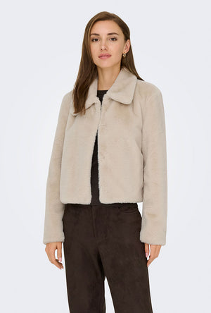 Front image of a model wearing the Macy faux fur jacket in beige, by brand Jacqueline de yong
