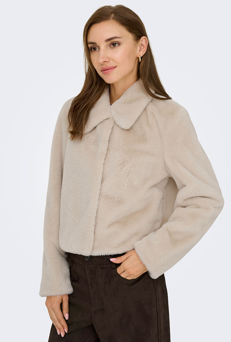 Front image of a model wearing Macy faux fur jacket in beige, by brand Jacqueline de yong