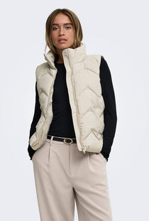 Front image of a model wearing the Power short waistcoat in beige, by brand Jacqueline de yong