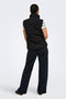 Back image of a model wearing the Power short waistcoat in black, by brand Jacqueline de yong