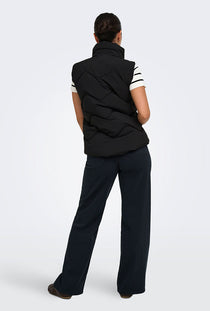 Back image of a model wearing the Power short waistcoat in black, by brand Jacqueline de yong