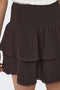 Front image of a model wearing the Theis life hw smock skirt in brown, by brand Jacqueline de yong