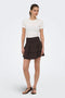Front image of a model wearing the Theis life hw smock skirt in brown, by brand Jacqueline de yong