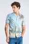 Front image of a model wearing Aop summer viscose shirt in sky, by brand Lindbergh
